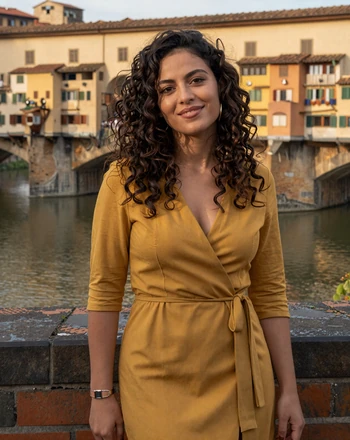 Margherita, 26, Italian woman from Florence with a playful smile on a bridge over the Arno